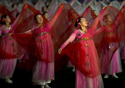 North Korean women dancing in choson-ot during the Arirang mass games in may day stadium, Pyongan Province, Pyongyang, North Korea