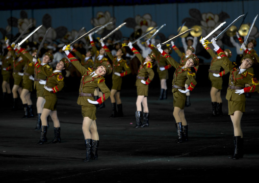 Sexy North Korean women dressed as soldiers dancing with swords during the Arirang mass games in may day stadium, Pyongan Province, Pyongyang, North Korea