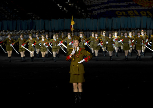 Sexy North Korean women dressed as soldiers dancing with swords during the Arirang mass games in may day stadium, Pyongan Province, Pyongyang, North Korea