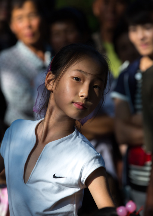 North Korean girl dancing in a park on september 9 day of the foundation of the republic, Pyongan Province, Pyongyang, North Korea