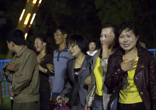 North Korean people with nausea coming down from a roller coaster in Kaeson youth park, Pyongan Province, Pyongyang, North Korea