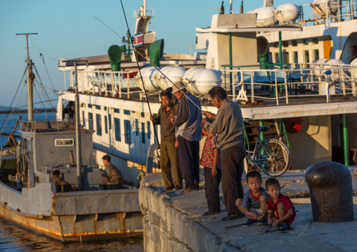 North Korean men fishing in the port, Kangwon Province, Wonsan, North Korea