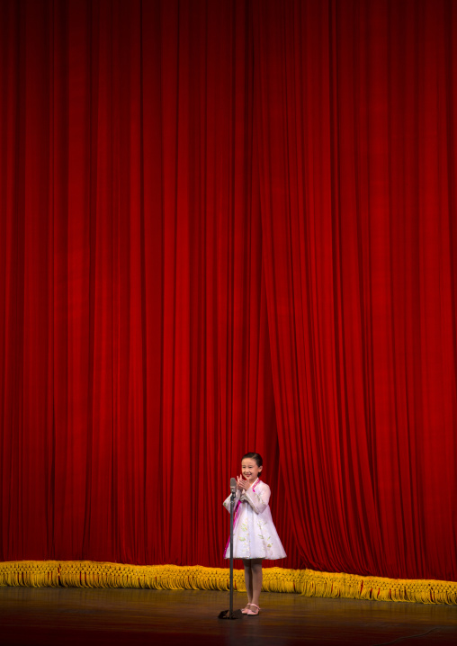 Young artist singing on stage in Mangyongdae children's palace, Pyongan Province, Pyongyang, North Korea
