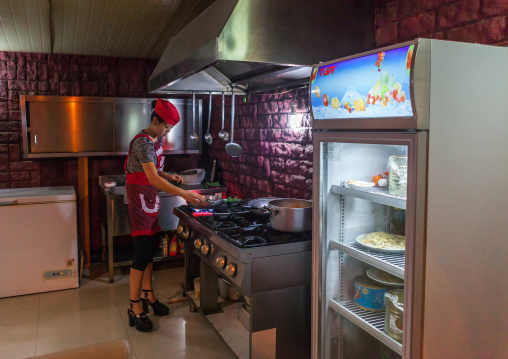 North Korean pizzeria cook in an italian restaurant, Pyongan Province, Pyongyang, North Korea
