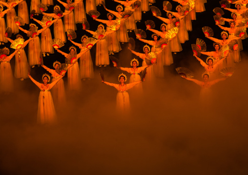 North Korean women dancing in choson-ot during the Arirang mass games in may day stadium, Pyongan Province, Pyongyang, North Korea