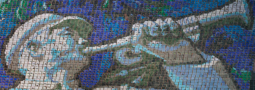 North Korean soldier blowing in a trumpet made by children holding up colored boards during Arirang in may day stadium, Pyongan Province, Pyongyang, North Korea