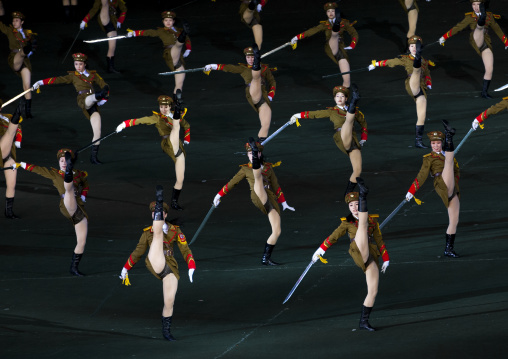 Sexy North Korean women dressed as soldiers dancing with swords during the Arirang mass games in may day stadium, Pyongan Province, Pyongyang, North Korea