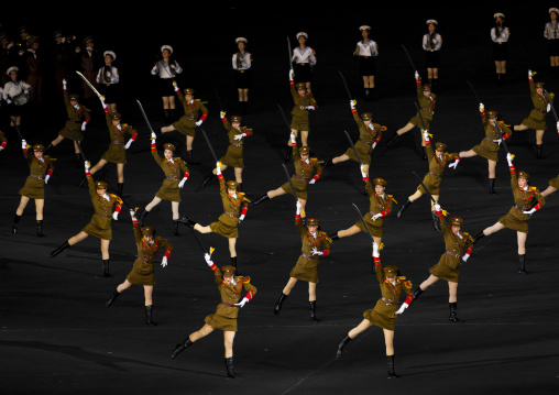Sexy North Korean women dressed as soldiers dancing with swords during the Arirang mass games in may day stadium, Pyongan Province, Pyongyang, North Korea
