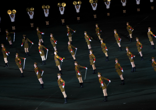 Sexy North Korean women dressed as soldiers dancing with swords during the Arirang mass games in may day stadium, Pyongan Province, Pyongyang, North Korea