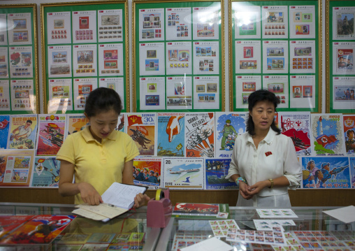 North Korean sellers in a stamps shop, North Hwanghae Province, Kaesong, North Korea