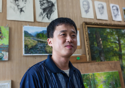 North Korean state artist in his workshop at Mansudae art studio, Pyongan Province, Pyongyang, North Korea