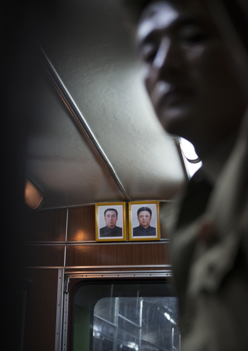 Official portraits of the Dear Leaders in a subway wagon, Pyongan Province, Pyongyang, North Korea