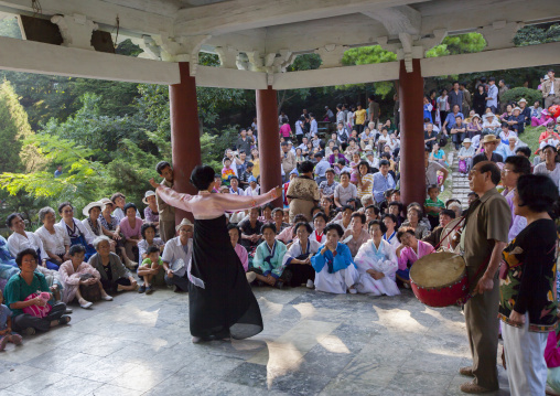 North Korean people dancing under a pavillon in a park on september 9 day of the foundation of the republic, Pyongan Province, Pyongyang, North Korea
