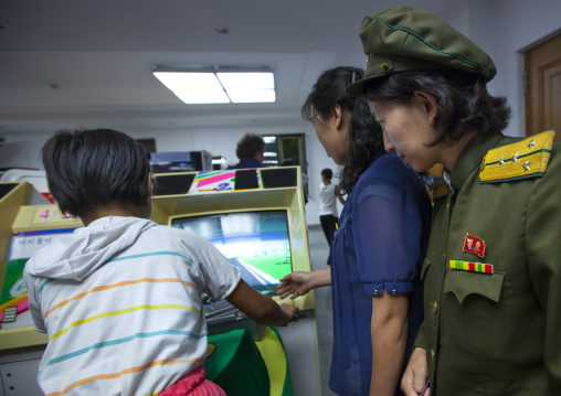 North Korean child on a motorbike simulator in Kaeson youth park, Pyongan Province, Pyongyang, North Korea