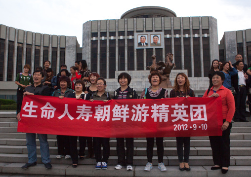 Chinese tourists in front of the Mangyongdae children's palace, Pyongan Province, Pyongyang, North Korea