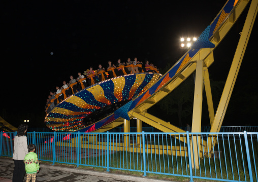North Korean people in a fairground attraction at Kaeson youth park, Pyongan Province, Pyongyang, North Korea