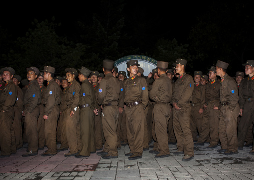 North Korean soldiers queueing for a fairground attraction at Kaeson youth park, Pyongan Province, Pyongyang, North Korea