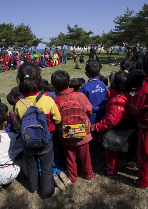 Young pioneers with Mickey mouse backpacks in a summer camp, North Hamgyong Province, Chilbo Sea, North Korea