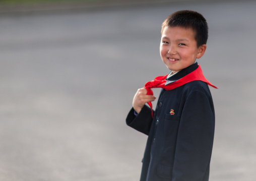North Korean pioneer boy in the street, Pyongan Province, Pyongyang, North Korea