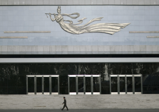 North Korean man passing in front of Mangyongdae children's palace, Pyongan Province, Pyongyang, North Korea