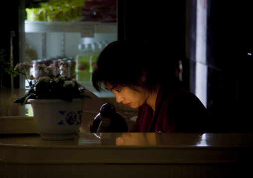 Cashier woman in a restaurant, Pyongan Province, Pyongyang, North Korea