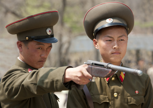 North Korean soldiers shooting at Taesongsan funfair, Pyongan Province, Pyongyang, North Korea