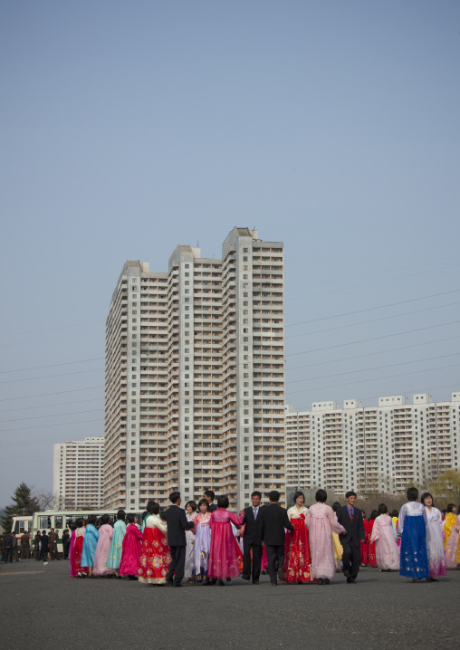North Korean young adults during a mass dance performance in front of buildings on military foundation day, Pyongan Province, Pyongyang, North Korea
