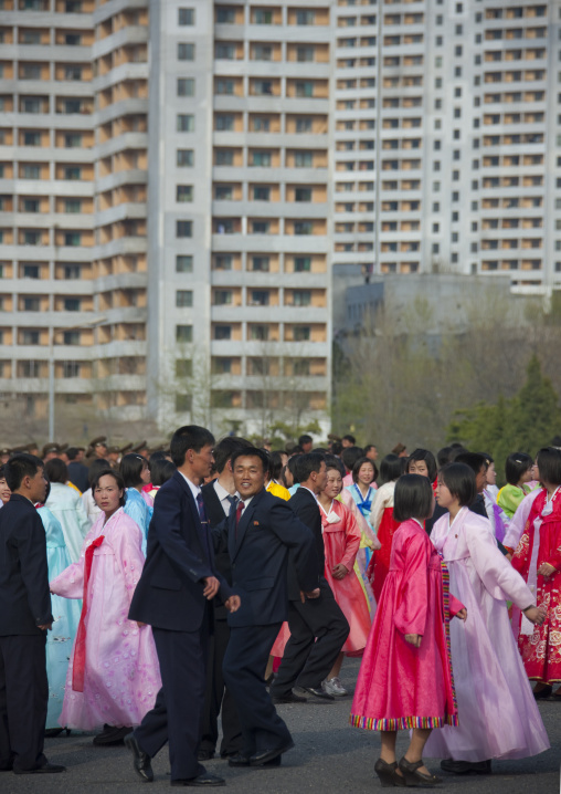 North Korean young adults during a mass dance performance in front of buildings on military foundation day, Pyongan Province, Pyongyang, North Korea
