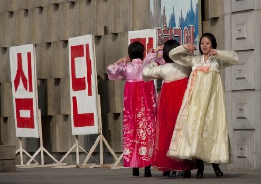 North Korean young adults during a mass dance performance in front of buildings on military foundation day, Pyongan Province, Pyongyang, North Korea