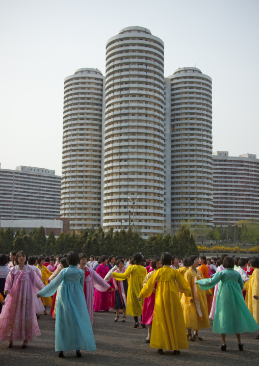 North Korean young adults during a mass dance performance in front of buildings on military foundation day, Pyongan Province, Pyongyang, North Korea