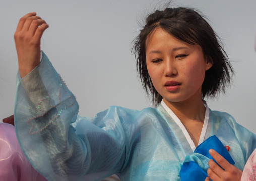North Korean young adults during a mass dance performance in front of buildings on military foundation day, Pyongan Province, Pyongyang, North Korea
