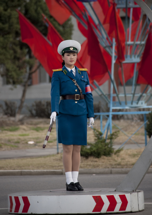 North Korean traffic security officer in blue uniform in the street, Pyongan Province, Pyongyang, North Korea