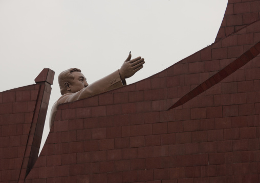 Kim il Sung statue behind the giant flag in Mansudae Grand monument, Pyongan Province, Pyongyang, North Korea