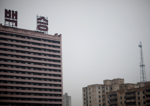 Dilapidated buildings with the slogan 100 fights 100 victories at the top, Pyongan Province, Pyongyang, North Korea