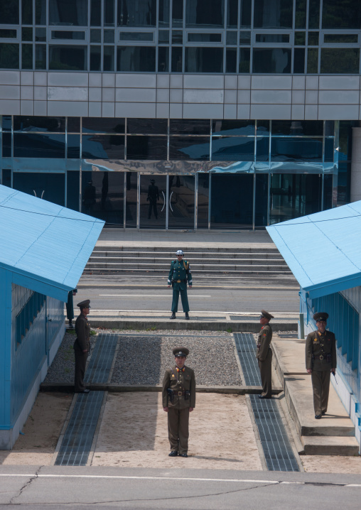 North Korean and south Korean soldiers standing in front of the United Nations conference rooms on the demarcation line in the Demilitarized Zone, North Hwanghae Province, Panmunjom, North Ko