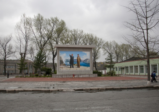 Kim il Sung and Kim Jong il on a propaganda fresco on a square, North Hwanghae Province, Kaesong, North Korea