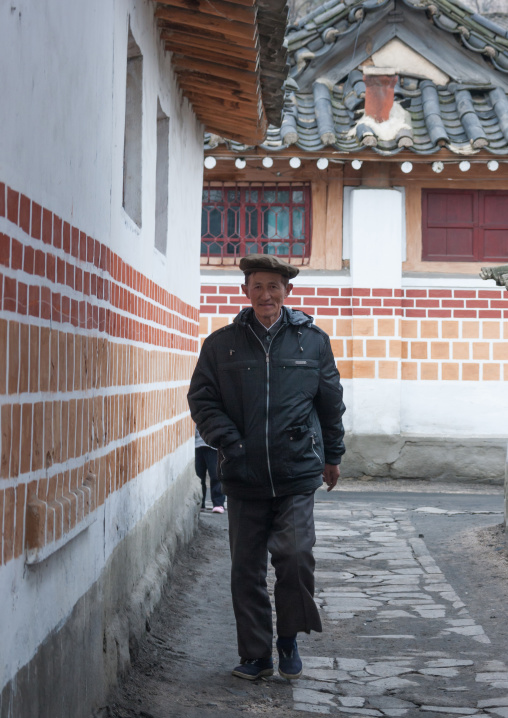 North Korean man walking in an old street, North Hwanghae Province, Kaesong, North Korea