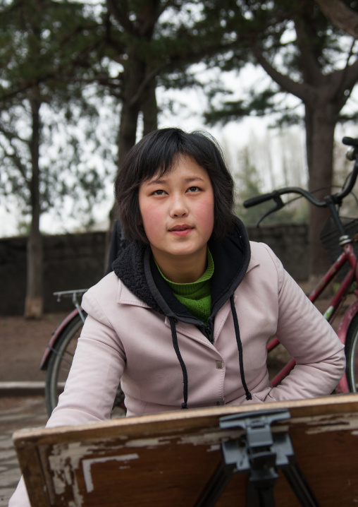 North Korean woman drawing in street, North Hwanghae Province, Kaesong, North Korea