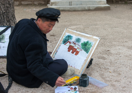 North Korean art student painting in the street, North Hwanghae Province, Kaesong, North Korea