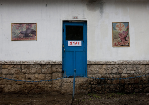 Official building with old propaganda posters on the wall, North Hwanghae Province, Kaesong, North Korea