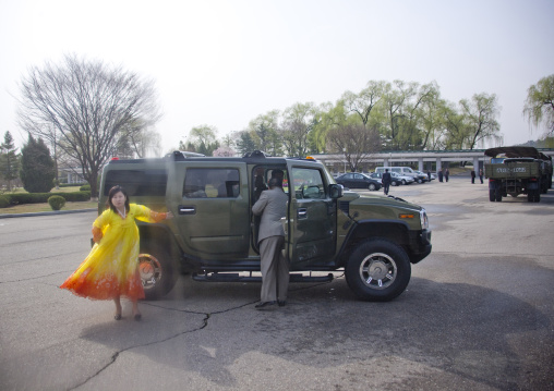 North Korean woman coming out of a hummer, Pyongan Province, Pyongyang, North Korea