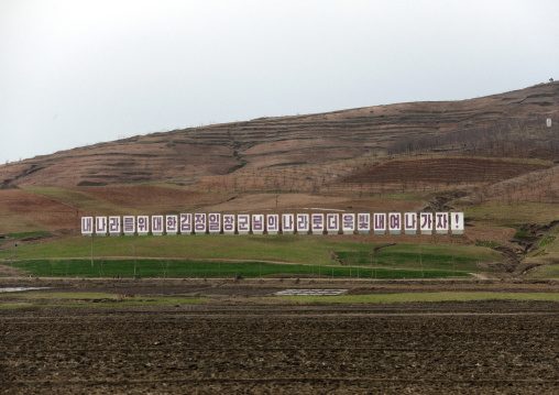 Propaganda billboard in a field, Pyongan Province, Pyongyang, North Korea