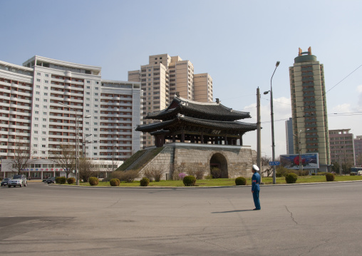 North Korean male traffic security officer in blue uniform in the street, Pyongan Province, Pyongyang, North Korea