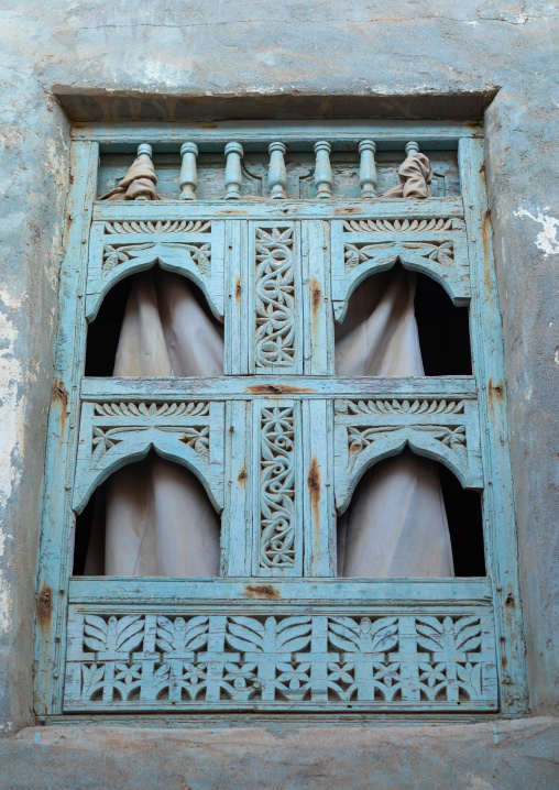 Wooden carved window of an abandoned house, Dhofar Governorate, Mirbat, Oman