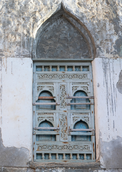 Wooden carved window of an abandoned house, Dhofar Governorate, Mirbat, Oman
