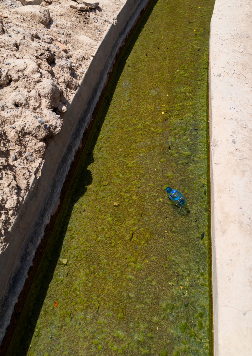 Pollution in a falaj transporting water thru an old village, Ad Dakhiliyah ‍Governorate, Birkat Al Mouz, Oman