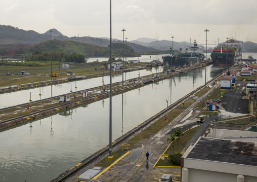Panama, Province Of Panama, Panama City, Container Ship Passing Through The Miraflores Locks In The Panama Canal