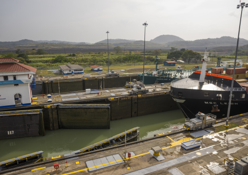 Panama, Province Of Panama, Panama City, Container Ship Passing Through The Miraflores Locks In The Panama Canal