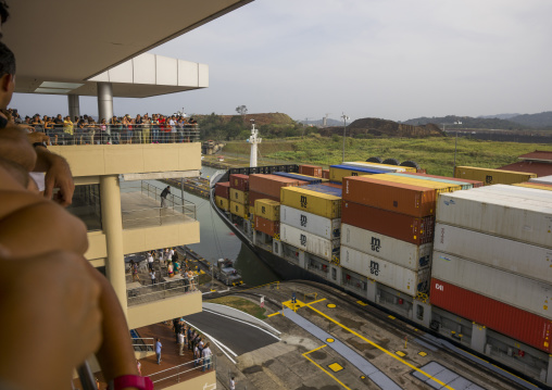 Panama, Province Of Panama, Panama City, Tourists Watching Container Ship Passing Through The Miraflores Locks In The Panama Canal