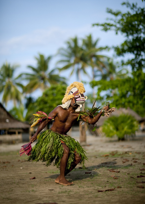Malagan tatuana masks dance during a funeral ceremony, New Ireland Province, Langania, Papua New Guinea